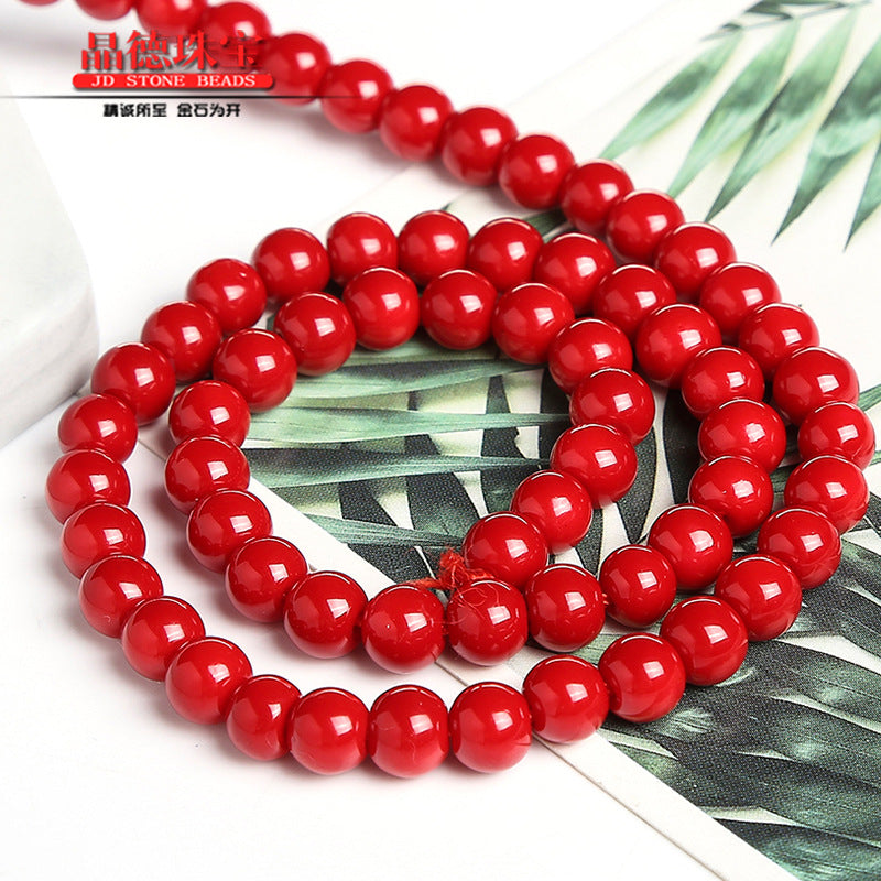 Red lacquered synthetic beads