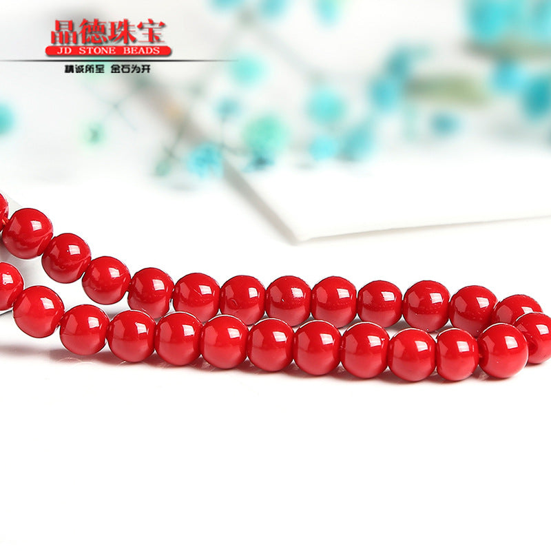 Red lacquered synthetic beads