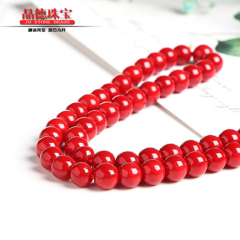 Red lacquered synthetic beads