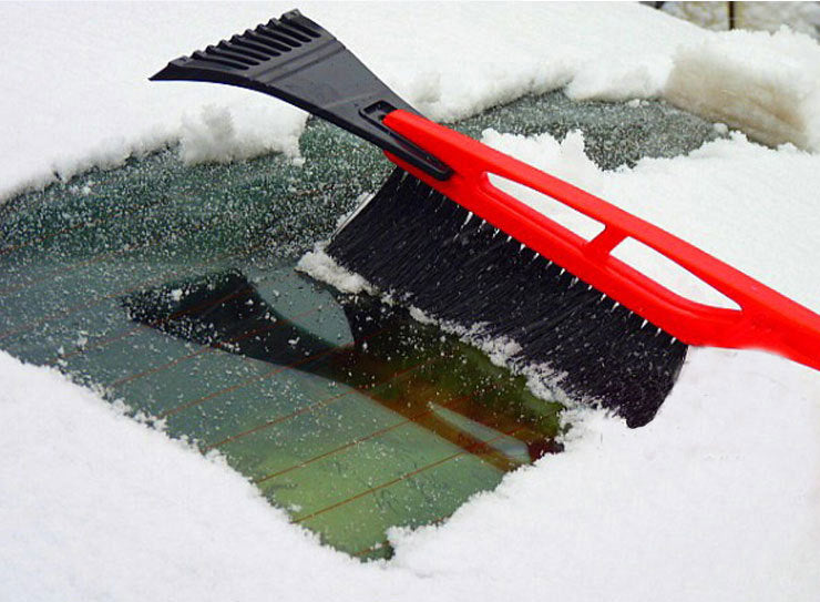 Deicing shovel with brush