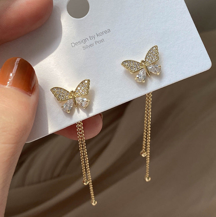 One pair of long butterfly stud earrings.