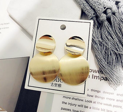 Retro metal disc hollow stud earrings