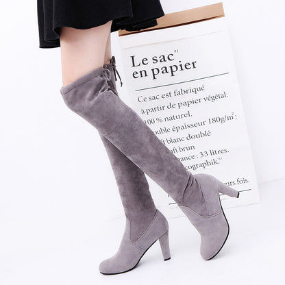 Over-the-knee boots and high heels