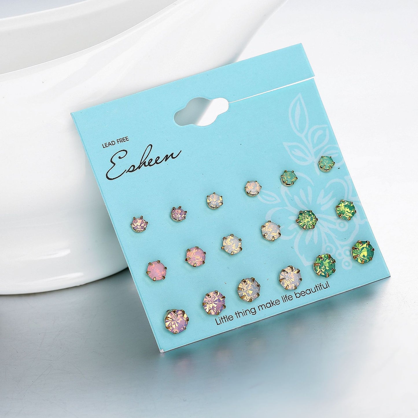 9 pairs of earrings in different sizes and colors