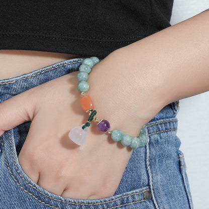 Blue chalcedony bracelet, white jade pumpkin bead pendant.