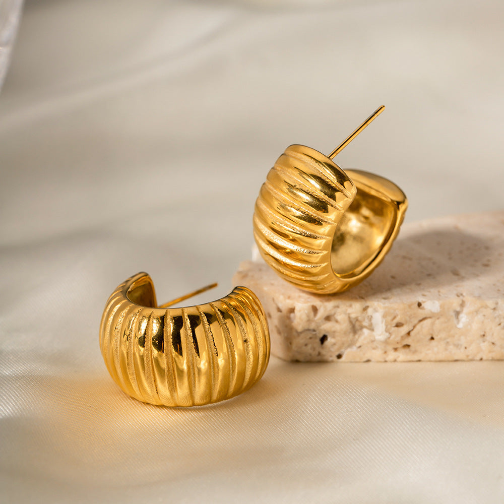 Wide breaded C-shaped earrings