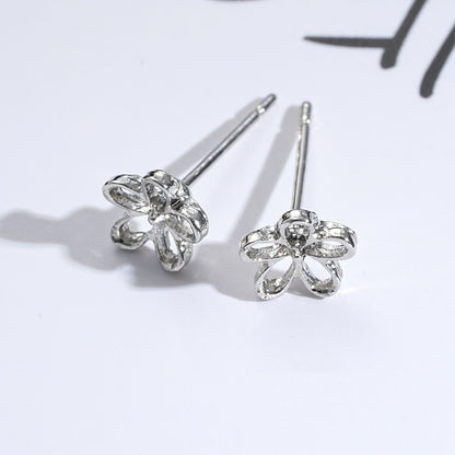 Silver hollow flower earrings