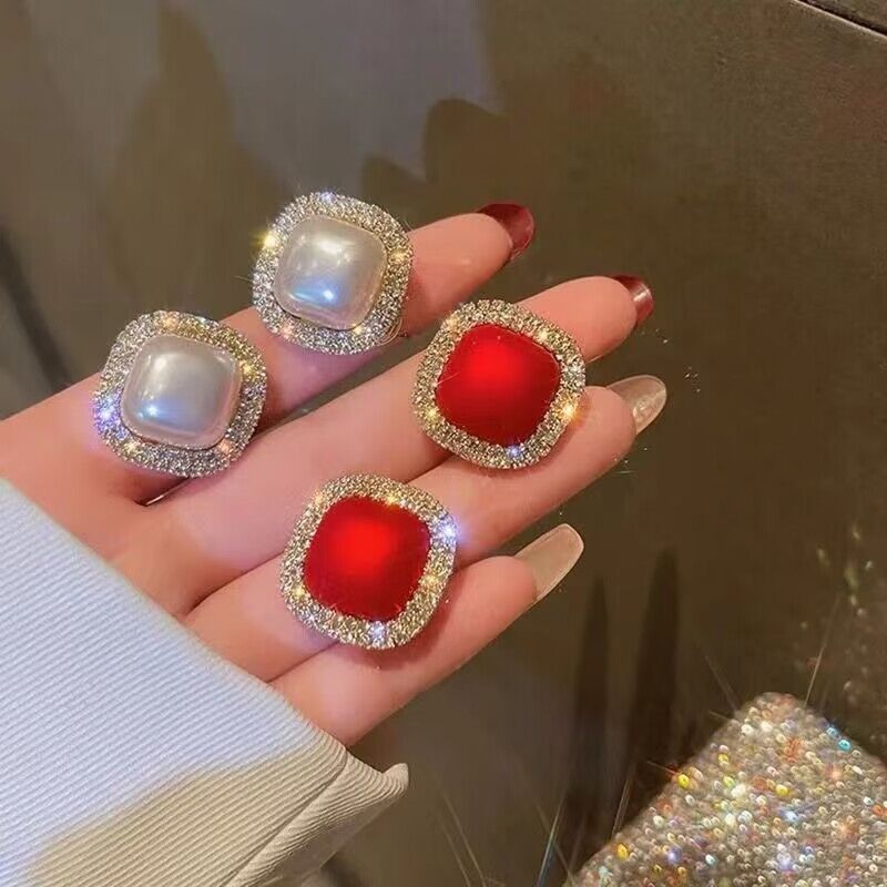 Pearl red stud earrings with diamonds