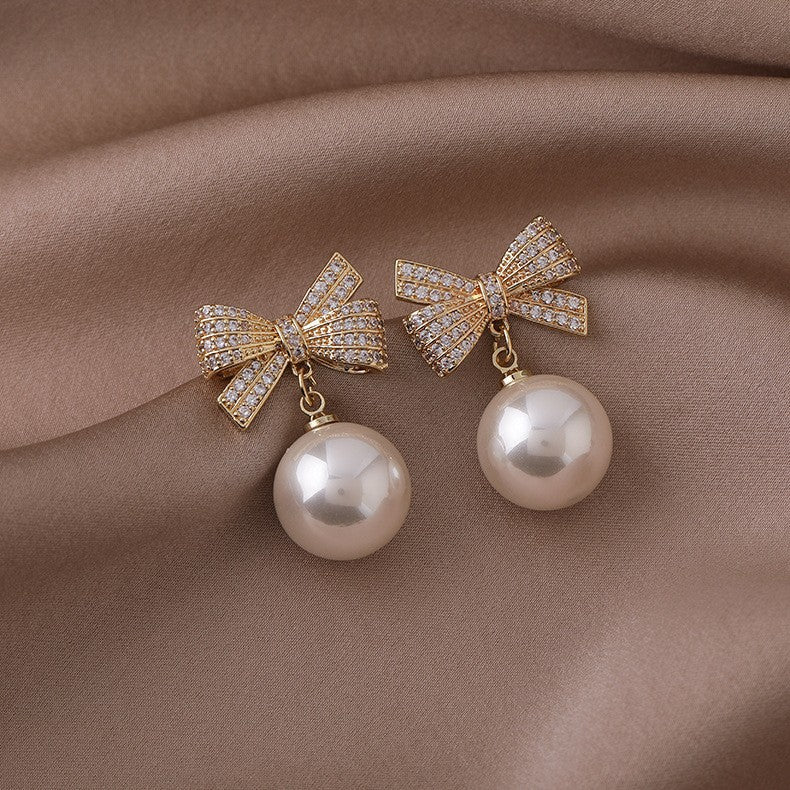 Bow bead diamond stud earrings