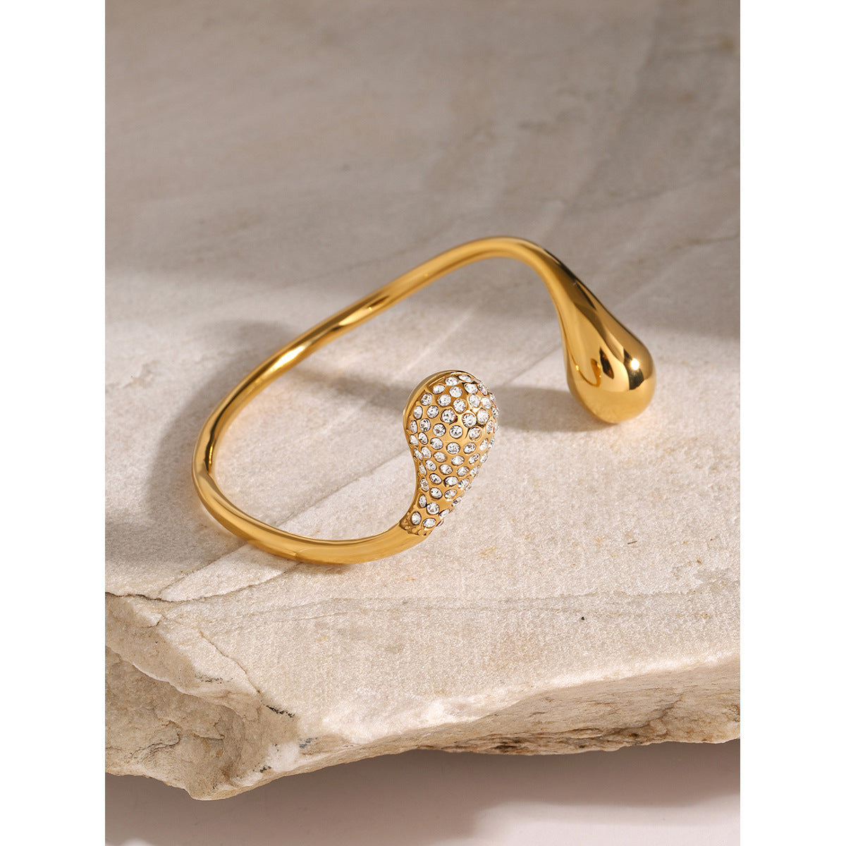 Asymmetric teardrop rhinestone cuff bracelet