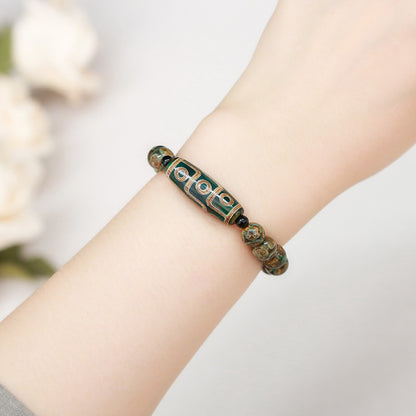 Green nine-eyed dzi bead bucket bead bracelet