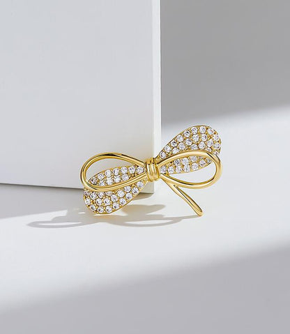 Bow anti-light brooch