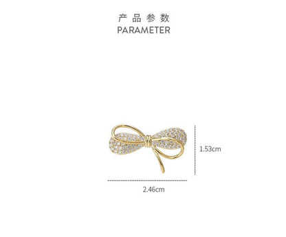 Bow anti-light brooch