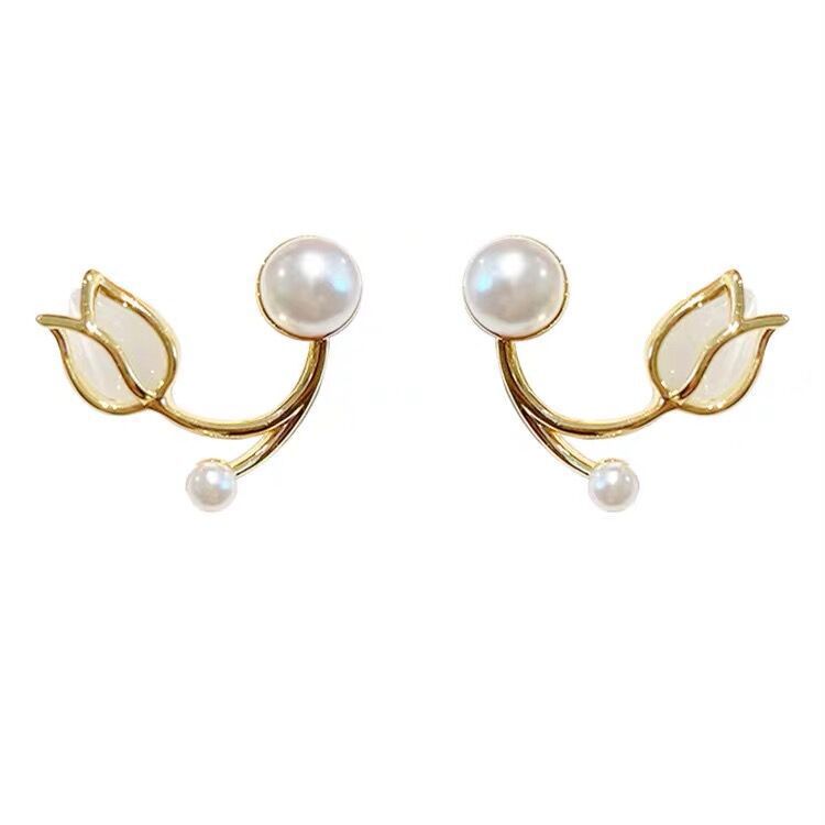 A pair of tulip flower pearl stud earrings.