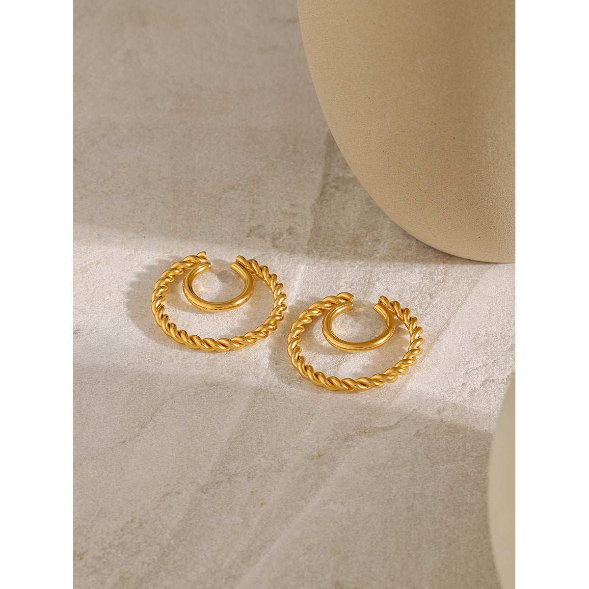 Double layer ear clip with twist coil