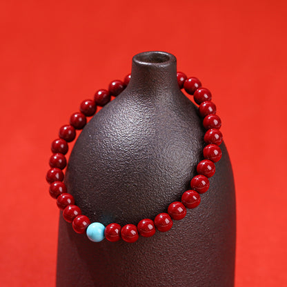 Cinnabar bead bracelet.