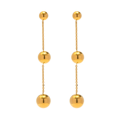 Three gold bead fringed earrings.