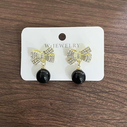 Bow bead diamond stud earrings