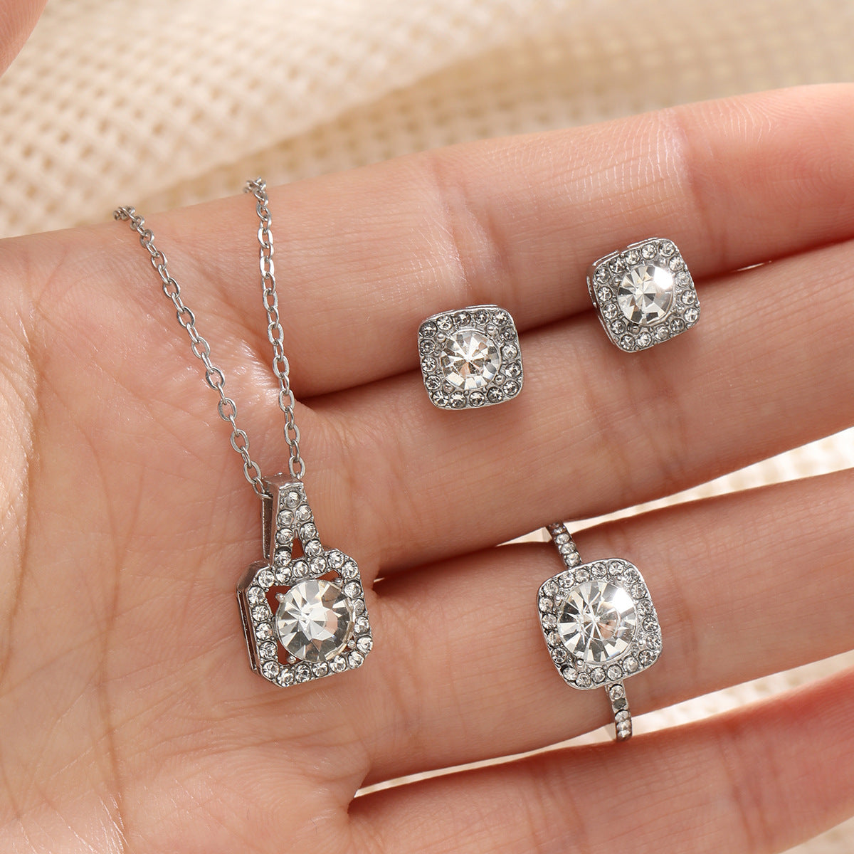 Elegant necklace, earrings and ring three-piece set