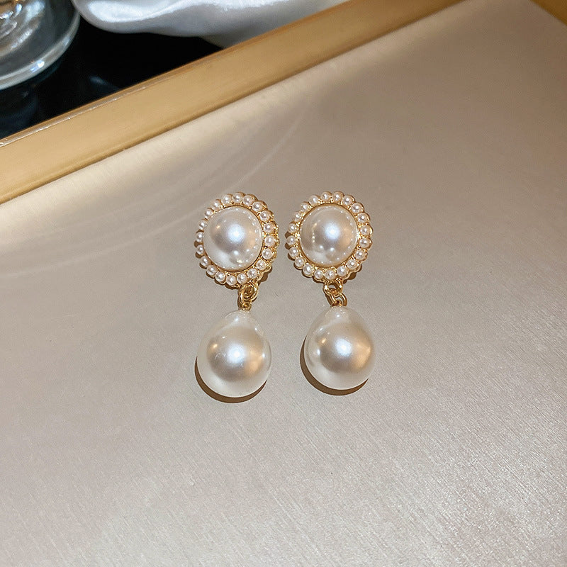 Red oval pearl earrings