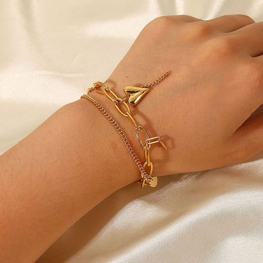 Double-layer bracelet with heart and star pendant