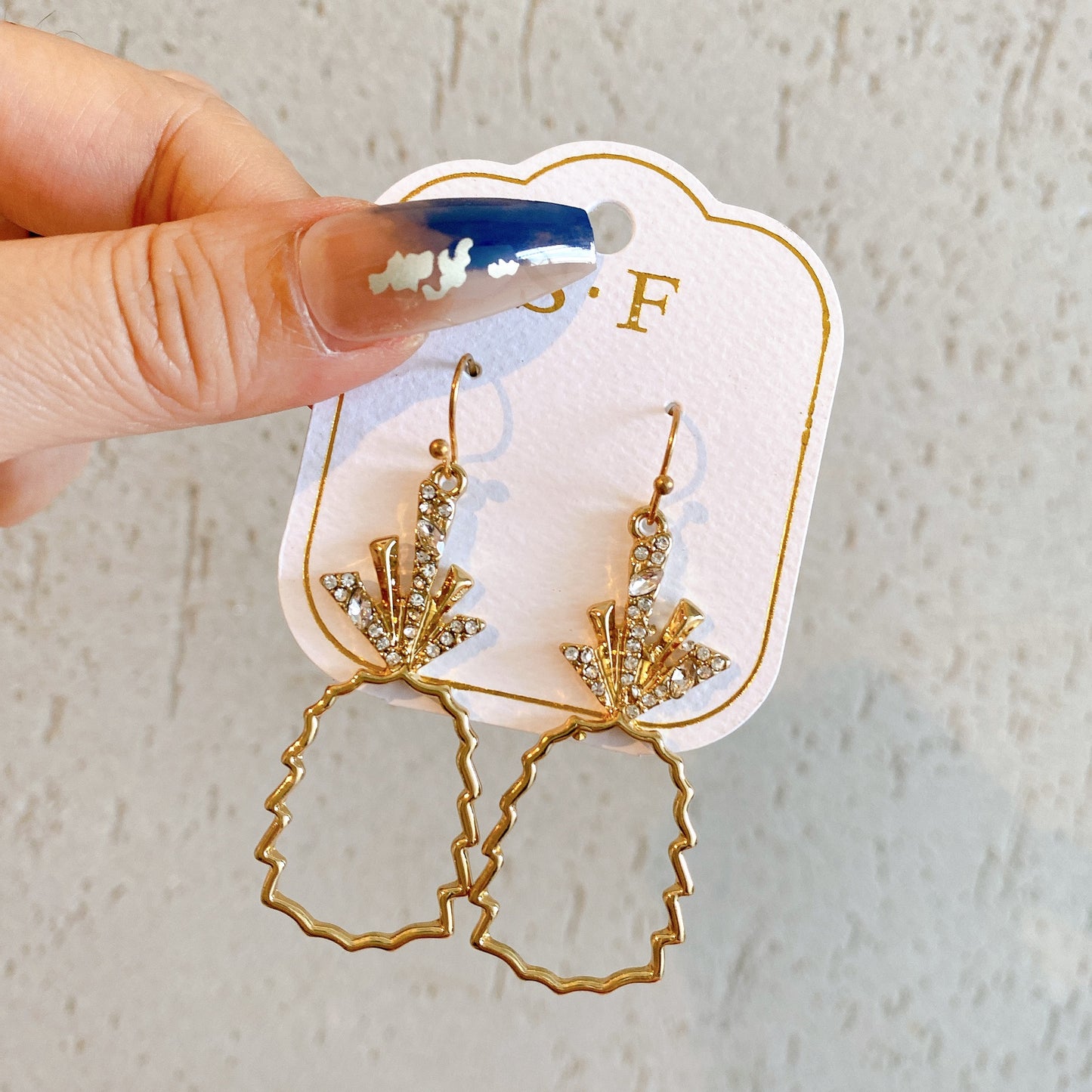 Gold hollow pineapple earrings