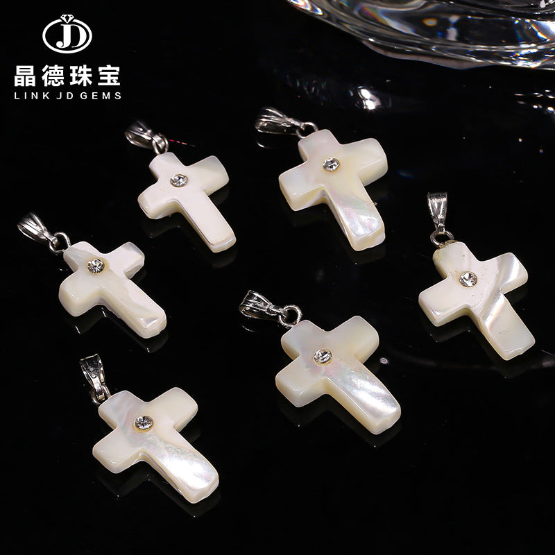 Natural white fritillary cross pendant.