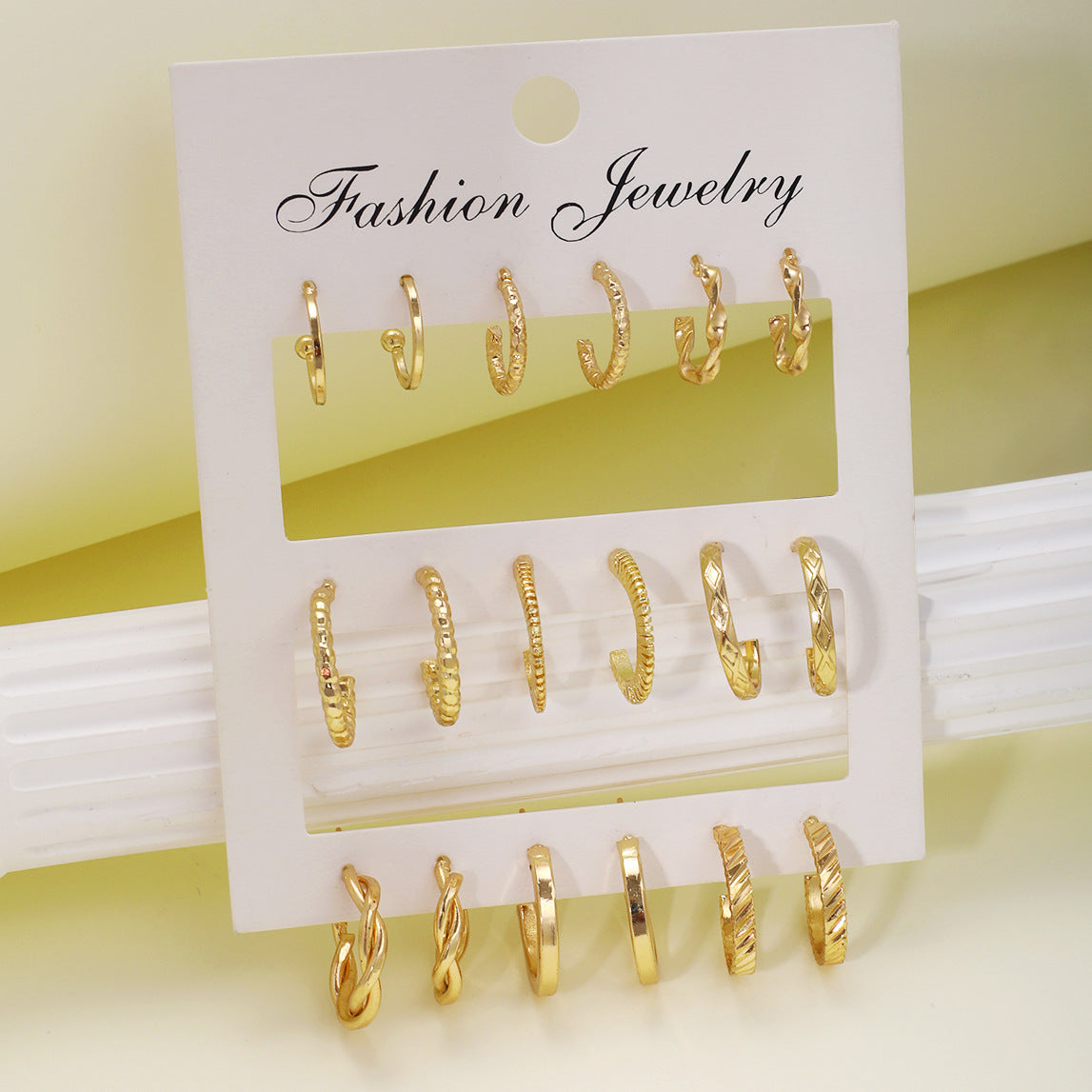 Gold twist earrings set 9 pieces