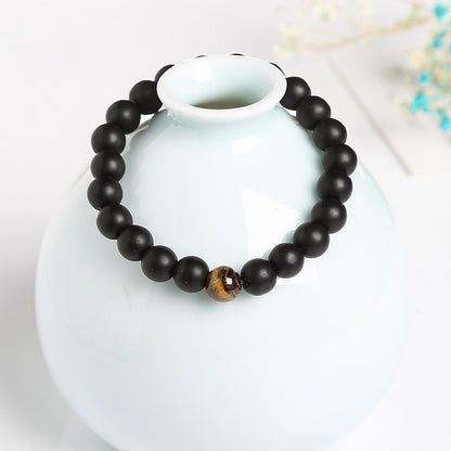 Pulsera de piedra negra esmerilada con ojo de tigre amarillo 