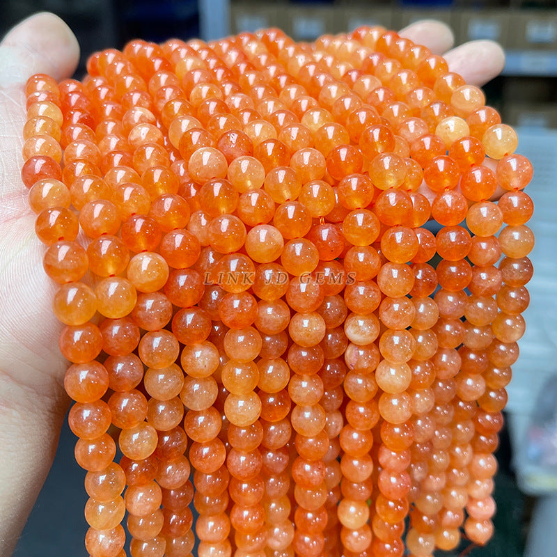 Perlas sueltas de calcedonia naranja optimizada de Xinjiang 