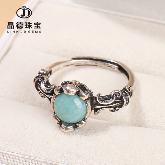 Natural sea pattern stone ring copper plated with Tibetan silver.