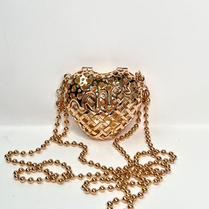 Heart-shaped metal hollow box bag.