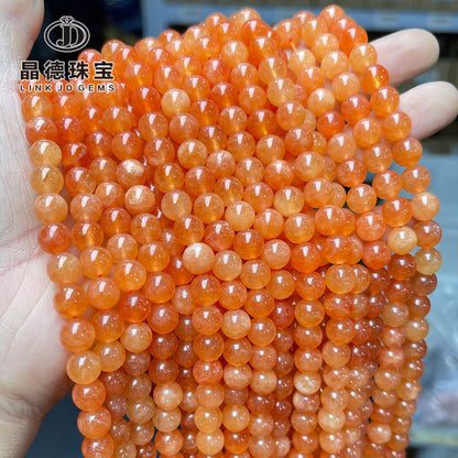 Perlas sueltas de calcedonia naranja optimizada de Xinjiang 