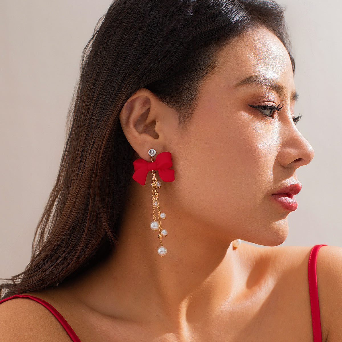 Red bow stud earrings