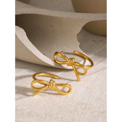 Linear bow C-shaped earrings