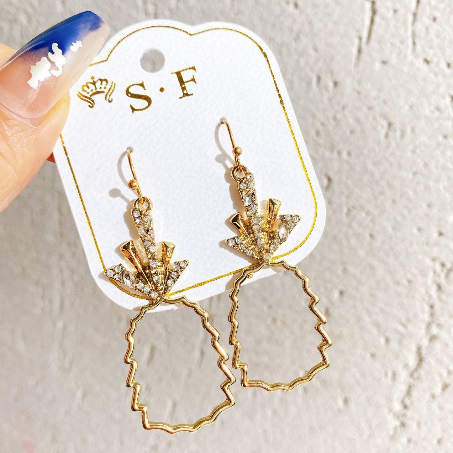 Gold hollow pineapple earrings