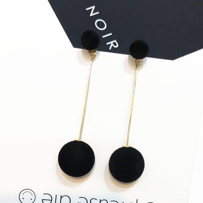 Large and small pom-pom long stud earrings.