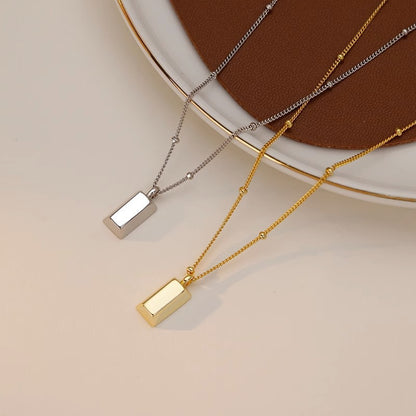 Long square small gold brick necklace