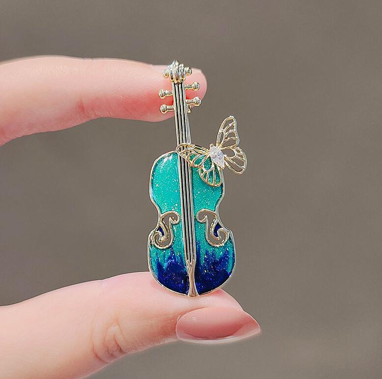 Blue violin brooch