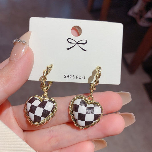 Black leather heart checkerboard stud earrings