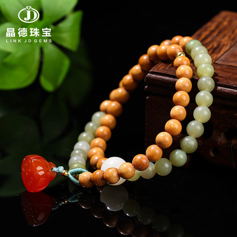 Natural sapphire round bead sandalwood bracelet.