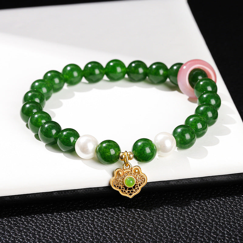 Imitation Hetian jade round bead bracelet.