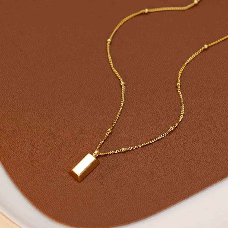 Long square small gold brick necklace