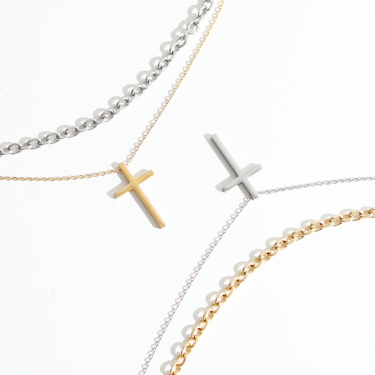 Cross pendant stacked with titanium steel necklace