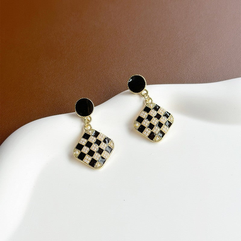 Black checkerboard rice bead earrings