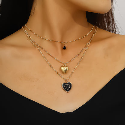 Multi-layered black oil-dripping peach heart necklace