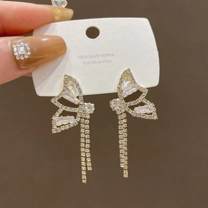 Diamond bow fringed earrings