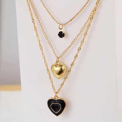 Multi-layered black oil-dripping peach heart necklace