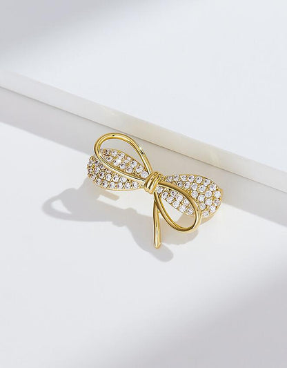 Bow anti-light brooch