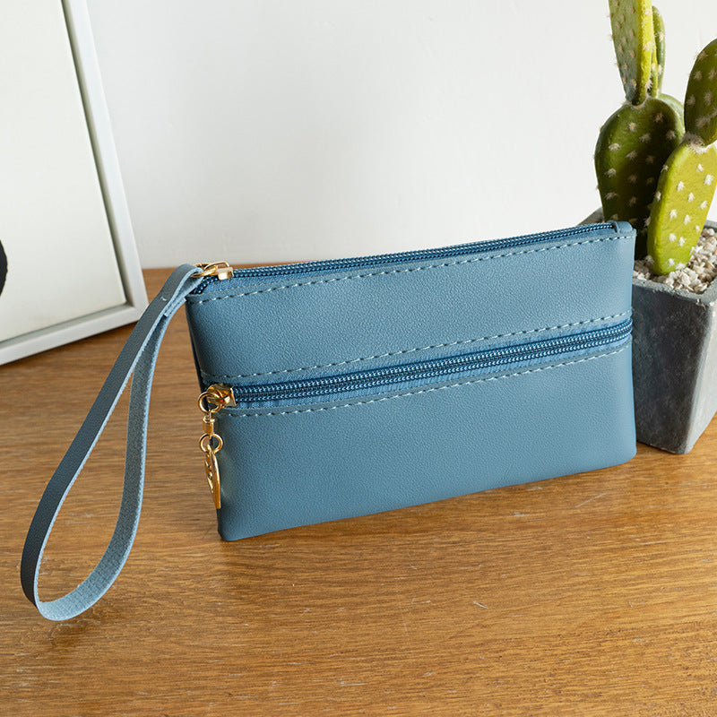 Double pull women's clutch bag